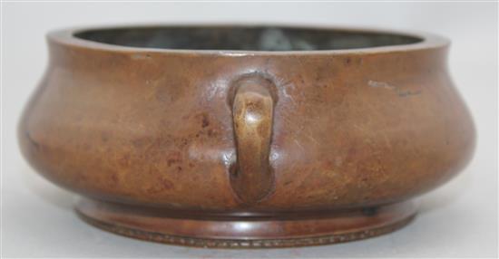 A Chinese bronze two handled censer, Gui, Xuande two character mark, 19cm.